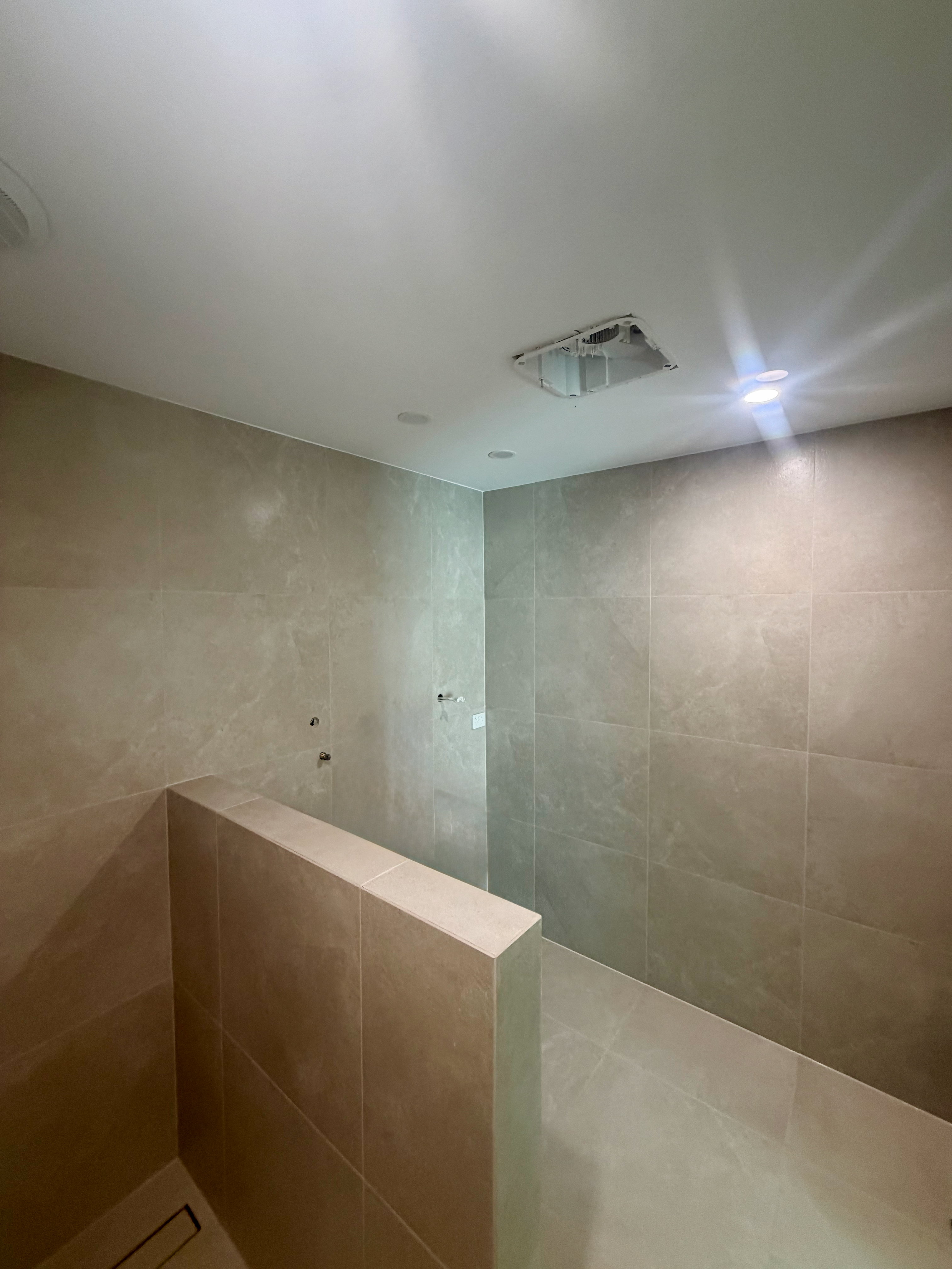 High-end tiling result with custom detail work and modern fittings